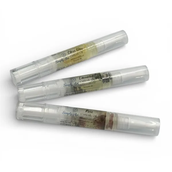 Three Simply Ari Cuticle Oil Pens in Citrus Glow, Lavender, and Rose with real botanicals in clear twist applicators